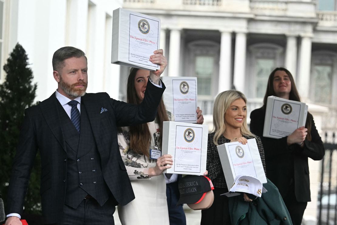 From left. Political commentator Rogan O'Handley, aka DC Draino, TikToker Chaya Raichik, commentator Liz Wheeler and US conservative activist Scott Presler carry binders bearing the seal of the US Justice Department reading 