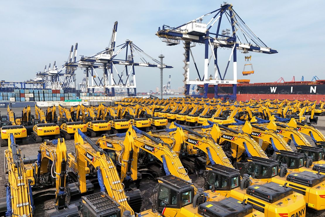 Excavators to be exported to Africa are seen waiting to be loaded on a cargo ship at a port in Yantai, in eastern China's Shandong province, on March 7, 2025.