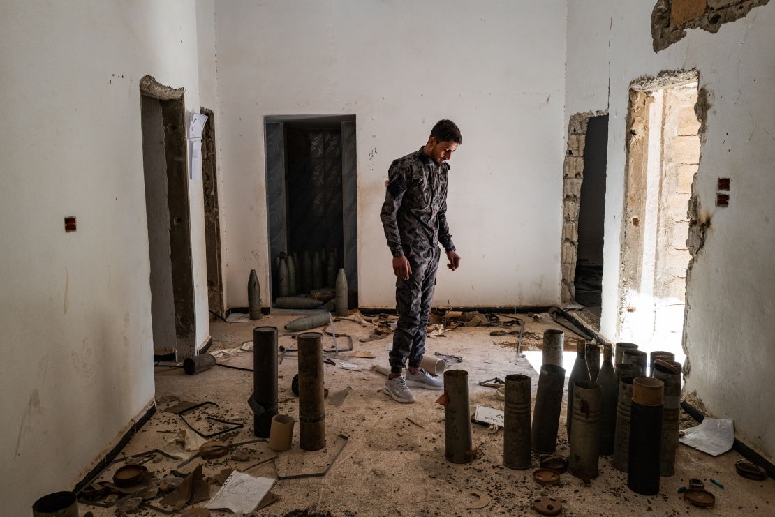 A solider with Syria's ministry of defense forces at a house which Hezbollah and Iranian backed militia had used as a weapon storage in Palmyra, Syria, in March 2025.