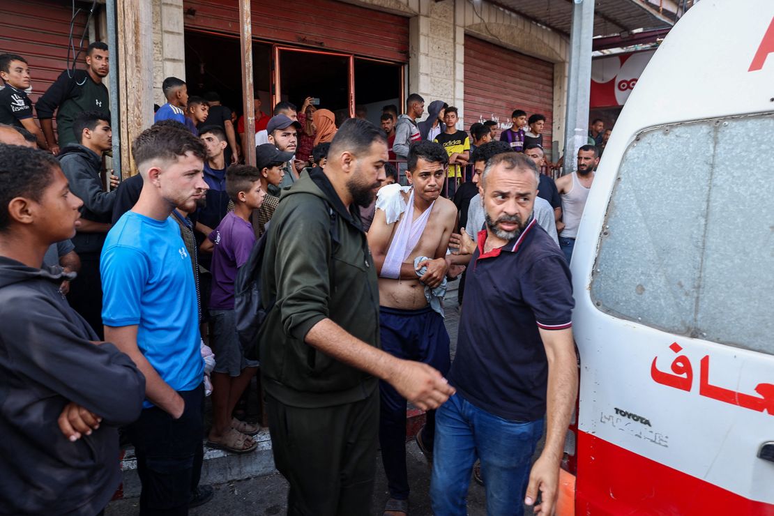 Palestinian rescuers arrive to evacuate injured people after an Israeli drone reportedly opened fire on civilian gatherings near an aid distribution point on June 1.