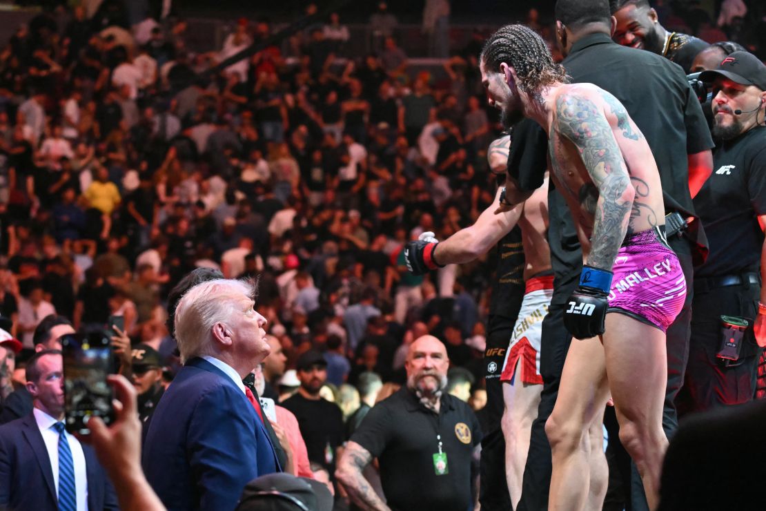 President Donald Trump (L) talks to US mixed martial artist Sean O'Malley (R) after he lost against unseen Georgian mixed martial artist Merab Dvalishvili during a UFC 316 event, at the Prudential Center in Newark, New Jersey on June 7, 2025.