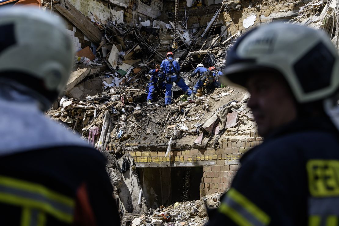 Rescuers work at the site of a Russian missile strike on a residential building during an attack in Kyiv, Ukraine, on June 23.