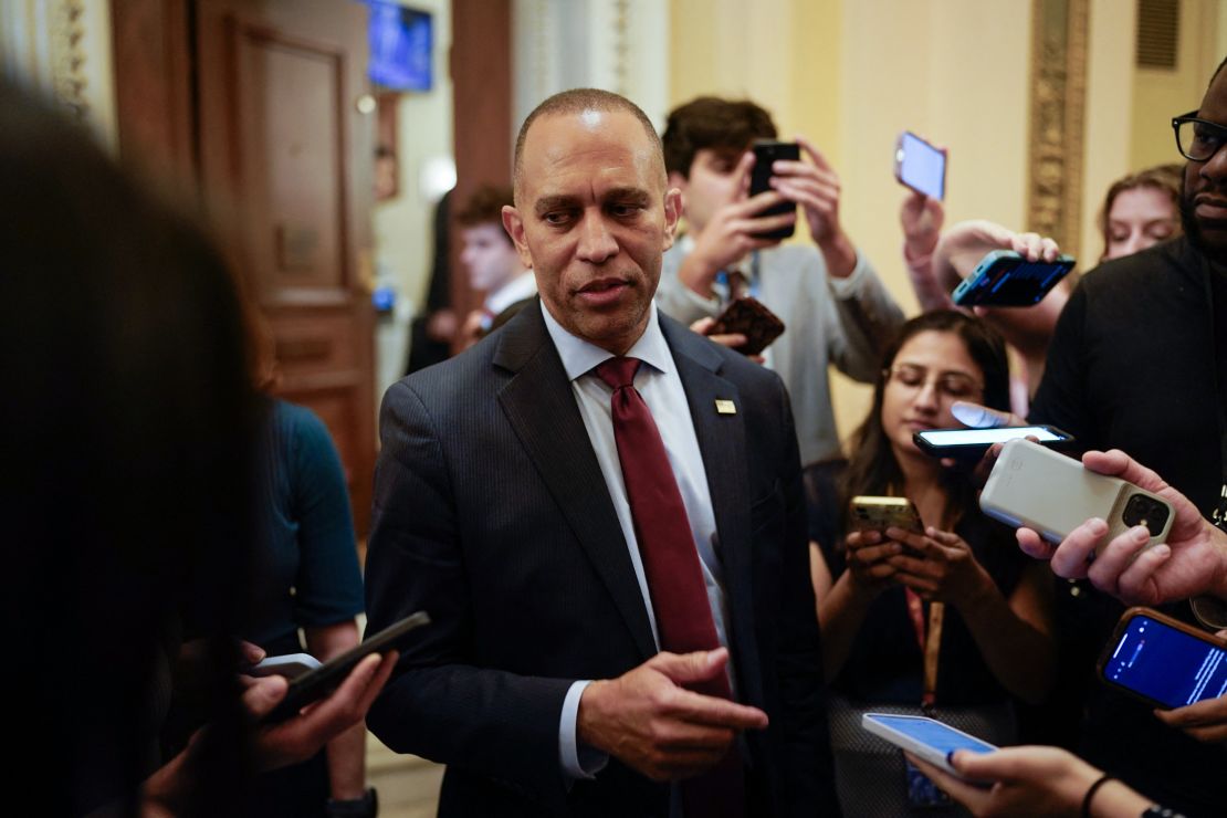 US House Minority Leader Hakeem Jeffries talks to reporters as he leaves the House floor on July 3.