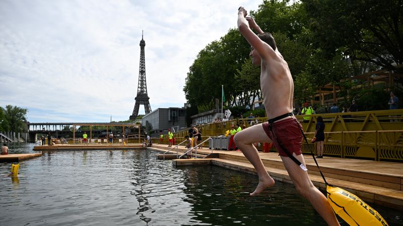 Joyful Parisians take a historic plunge into the Seine after 100 years