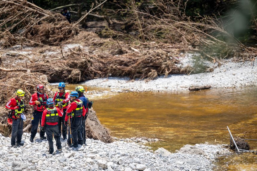 Unlike their time on the Rio Grande, these Mexican firefighters had to comb through piles of debris, overturned vehicles and shattered houses during their recovery searches in Texas.