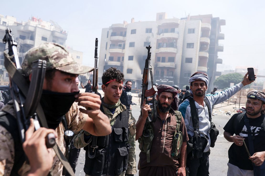 Beduin tribal fighters gather in the northern part of the city of Suwayda in southern Syria's Druze majority province.