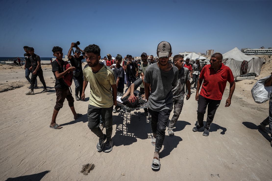Injured Palestinians are transported to hospitals after Israeli forces open fire on civilians waiting for humanitarian aid in the Zikim area on Sunday.