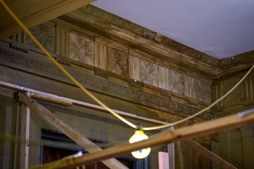 An example of water damage is visible along the ceiling in the historic lobby of the 1951 Constitution Avenue Building.