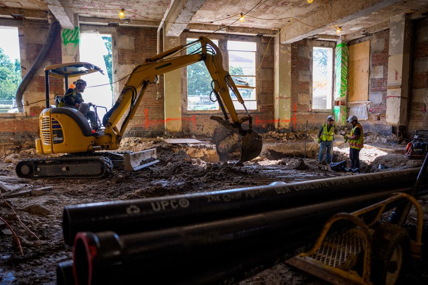 An excavator works on the ground floor of the Fed complex on July 24.