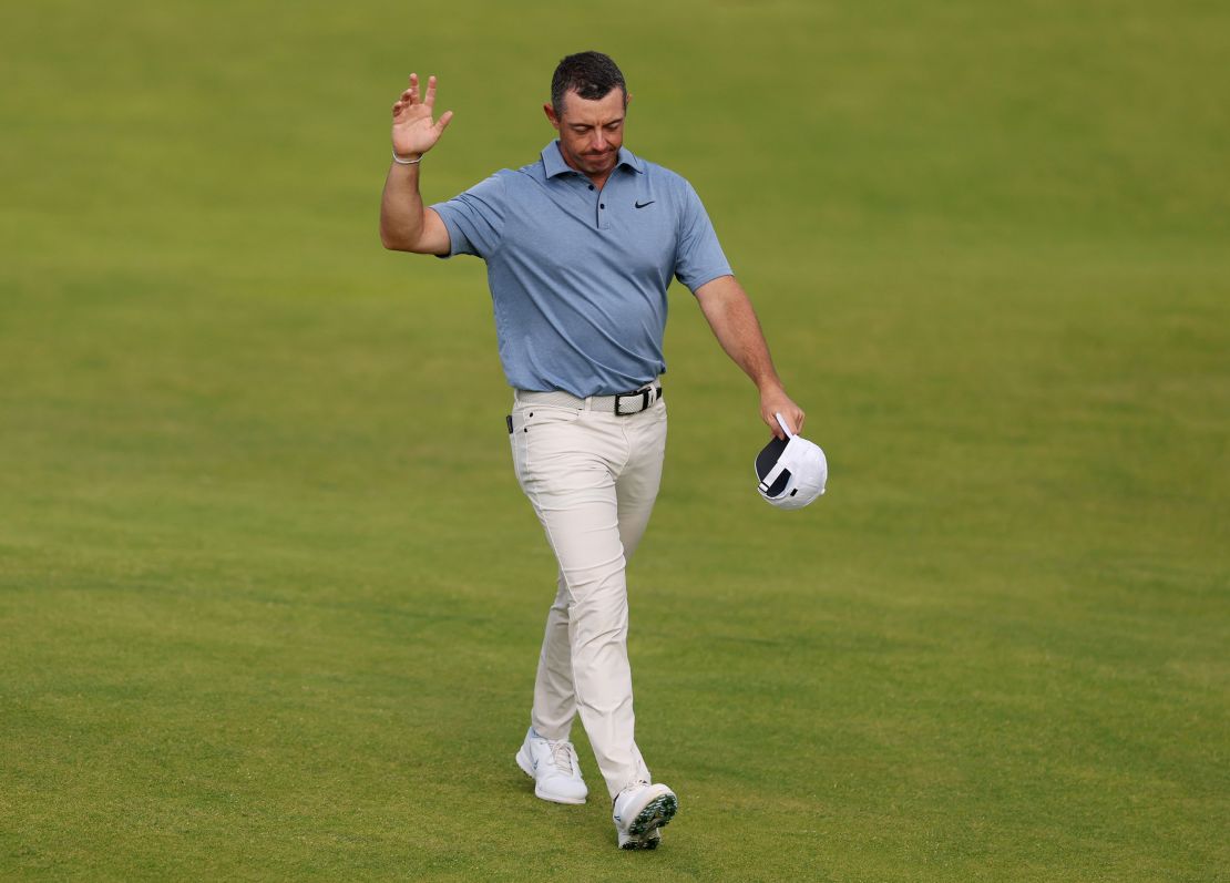 Rory McIlroy of Northern Ireland acknowledges the crowd as he walks to the 18th hole.