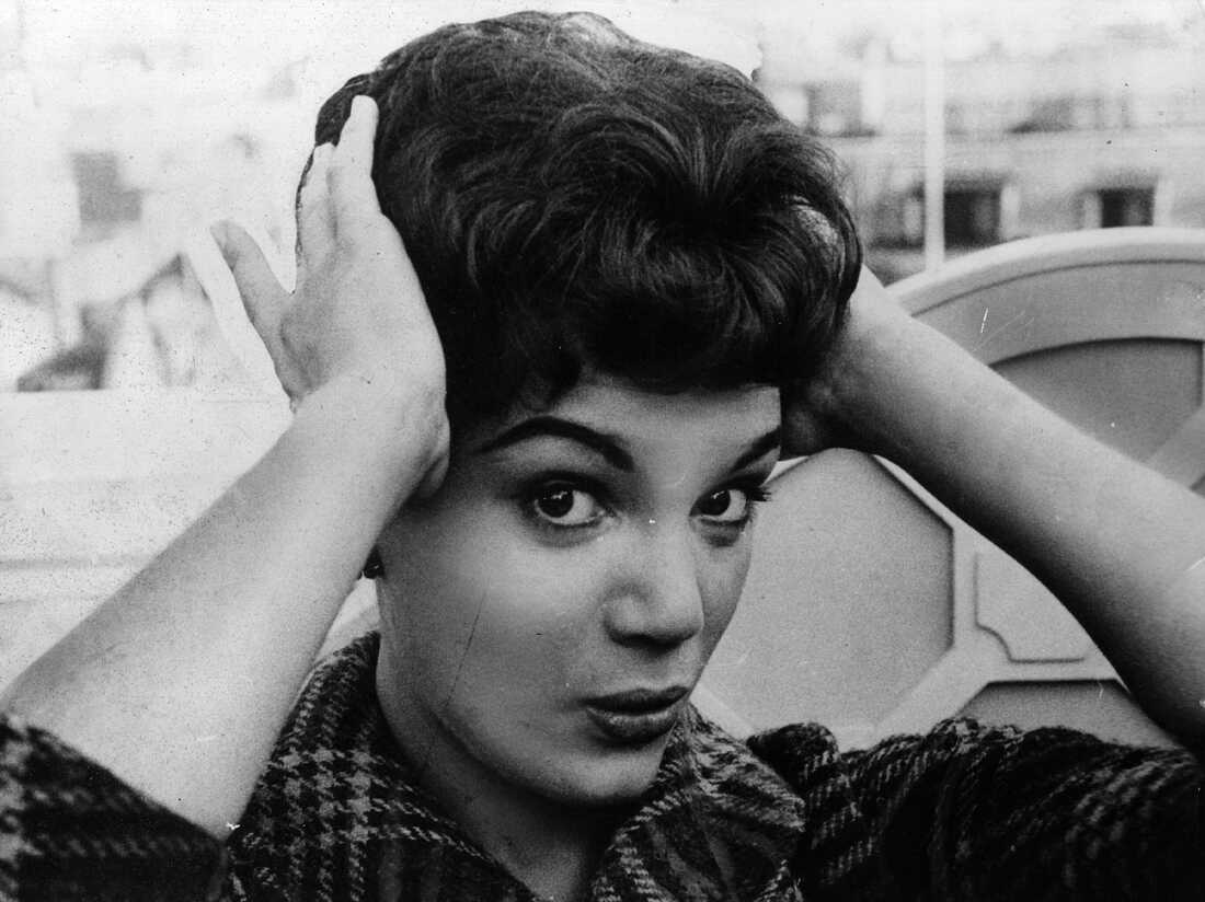 Connie Francis fixes her hair during a 1959 press reception at the Dorchester Hotel in London