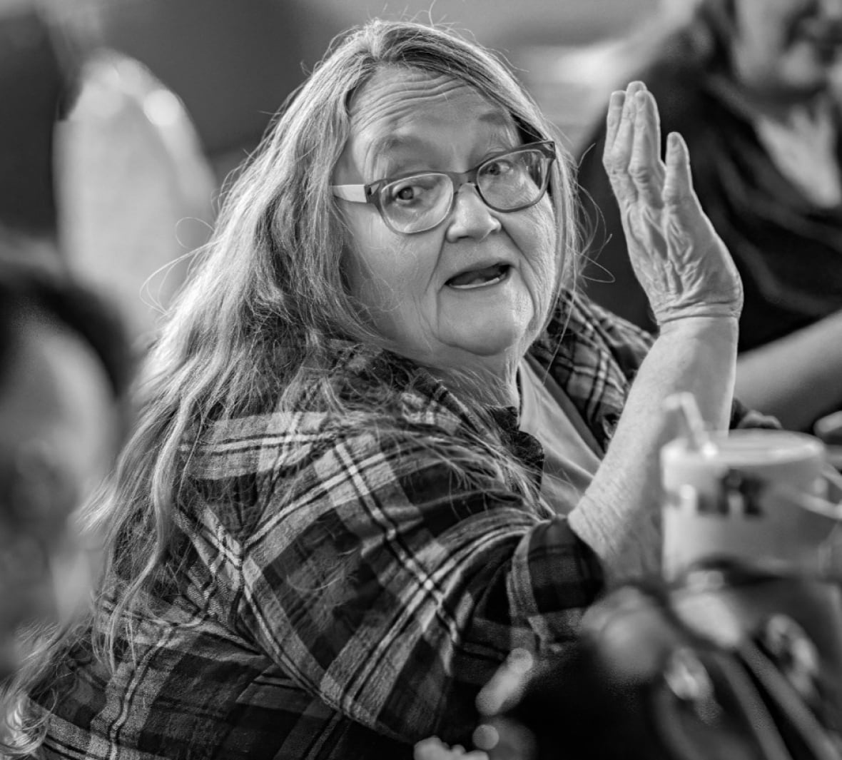 A portrait of a woman in black and white.