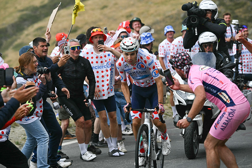 Bahrain - Victorious team's French rider Lenny Martinez wearing the best climber's polka dot (dotted) jersey cycles in a breakaway in the ascent of Col du Tourmalet during the 14th stage of the 112th edition of the Tour de France cycling race, 182.6 km between Pau and Luchon-Superbagneres, in the Pyrenees mountains of southwestern France, on July 19, 2025. (Photo by Loic VENANCE / AFP)
