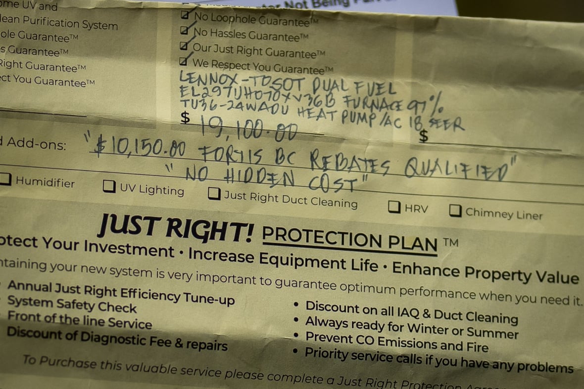 A piece of yellow paper putting the price of the unit at $19,100 and saying it was 'rebate qualified.'