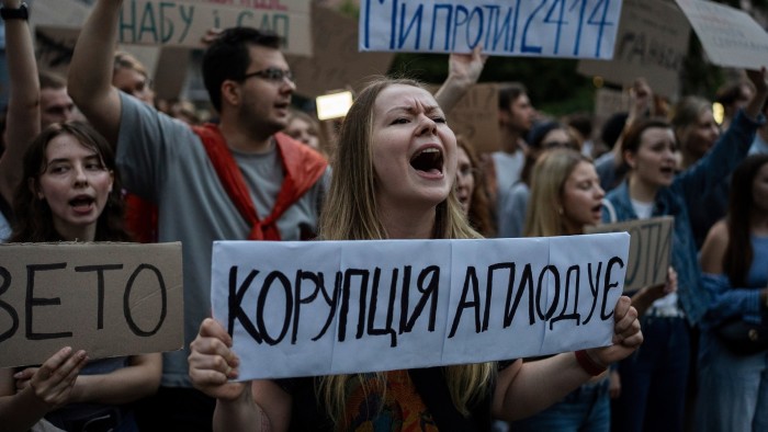 A woman during a protest against a law targeting anti-corruption institutions in central Kyiv