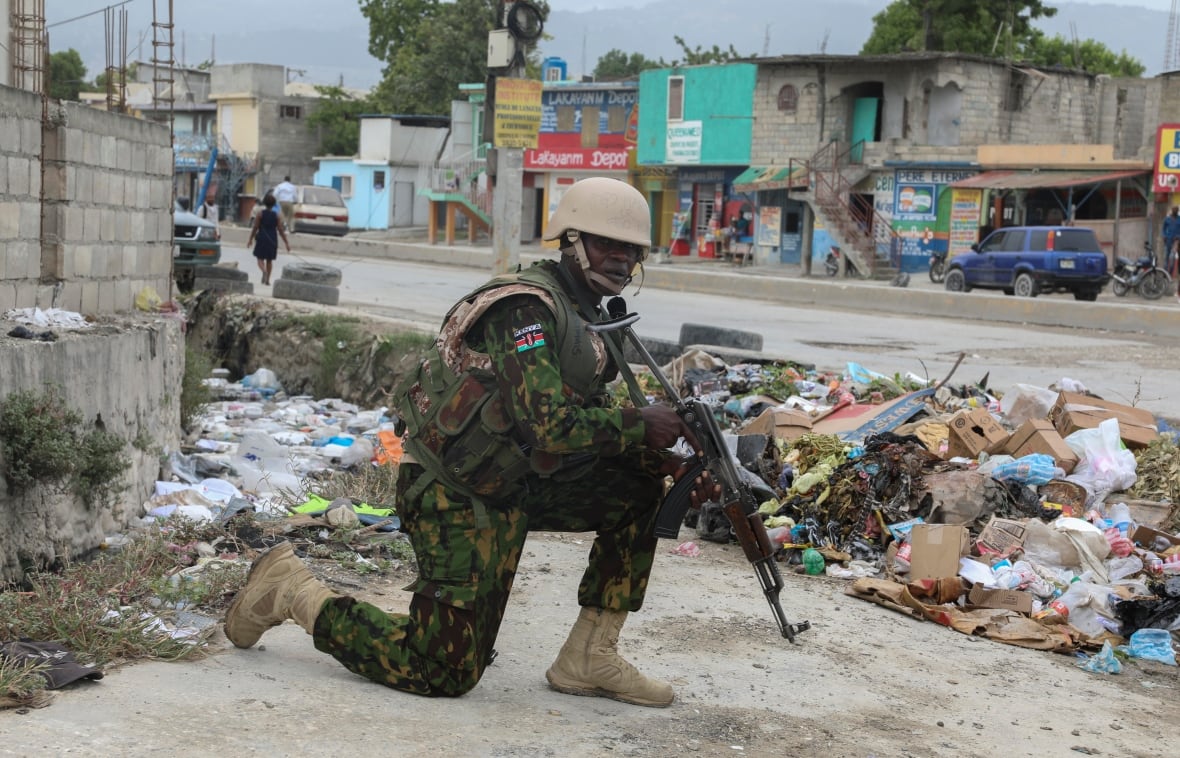 A Kenyan police officer is seen on patrol in an area near the international airport in Port-au-Prince, Haiti.