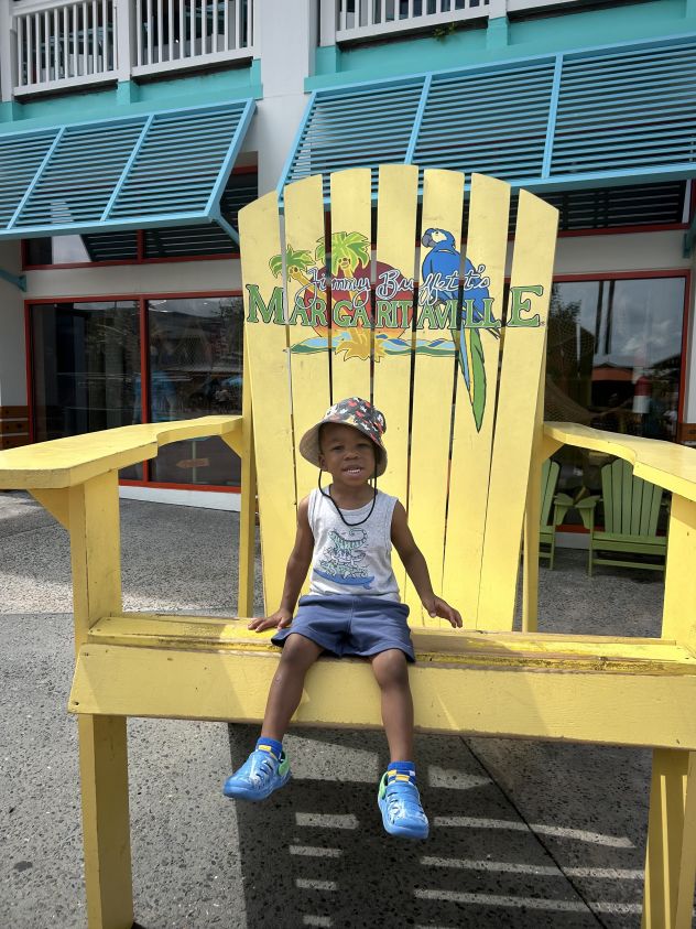 KJ was strapped inside the parked vehicle for hours outside the employee's home, the family's attorney told CNN.