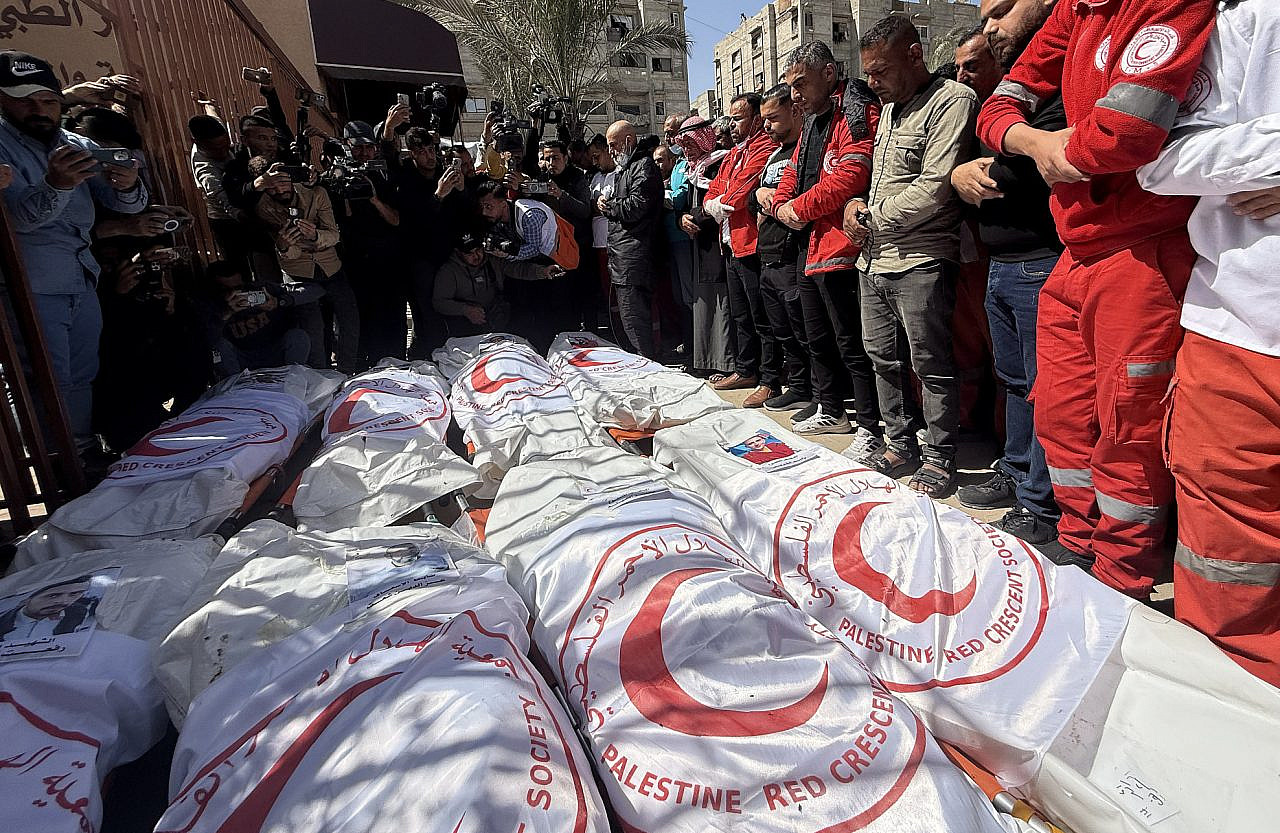 Families and colleagues of eight Palestinian Red Crescent workers killed by Israeli forces mourn as their bodies were finally recovered and brought to Nasser Hospital in Khan Younis, southern Gaza Strip, March 31, 2025. (Doaa Albaz/Activestills)