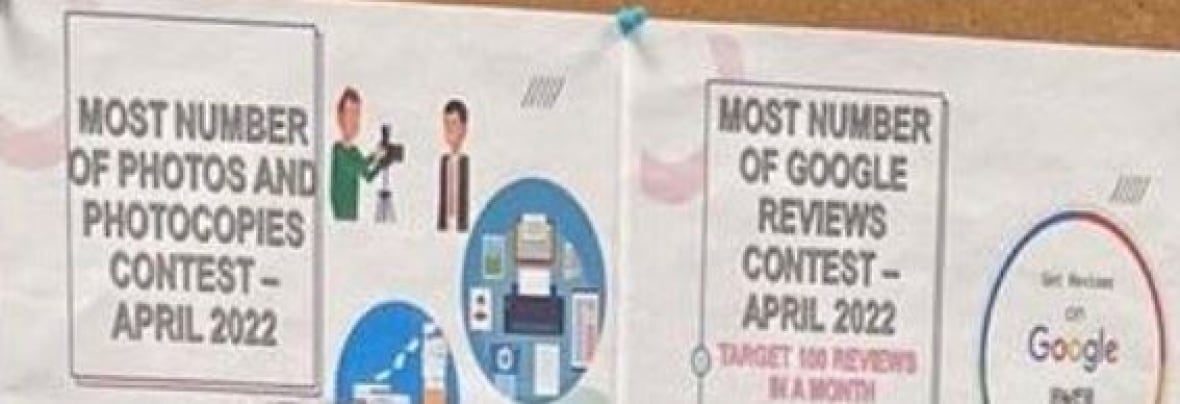 A sign on a corkboard inside the BLS offices says 'most number of photos and photocopies contest"