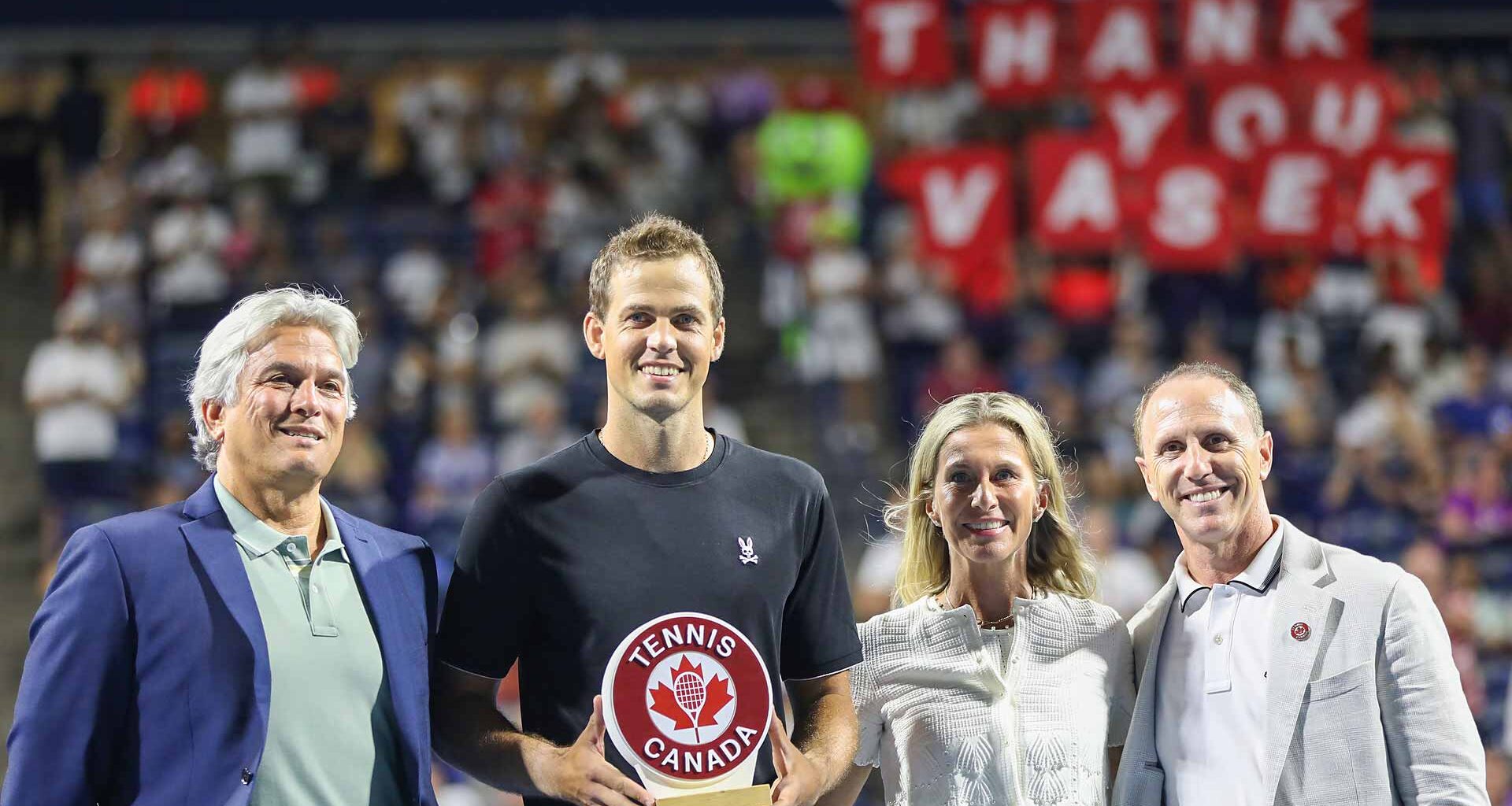 Vasek Pospisil celebrates his retirement after his match against Facundo Bagnis on Sunday evening in Toronto.