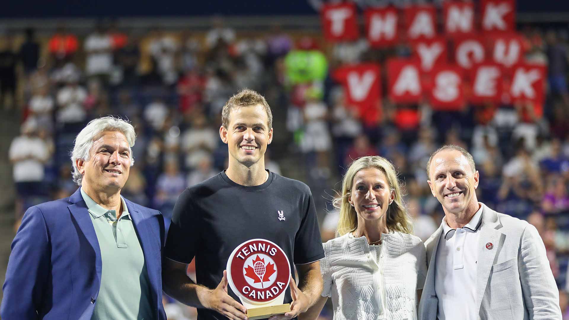 Vasek Pospisil celebrates his retirement after his match against Facundo Bagnis on Sunday evening in Toronto.