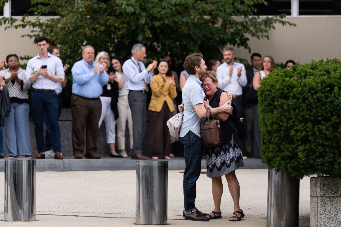 People fired from the US State Department leave the department’s headquarters in Washington, DC, on July 11.