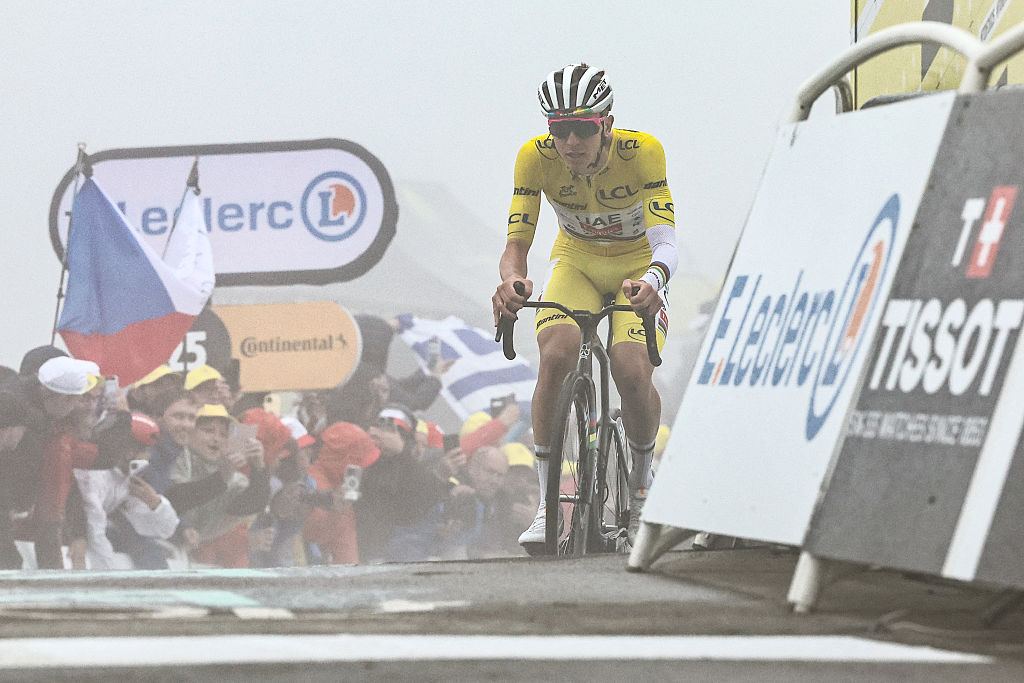 UAE Team Emirate - XRG team's Slovenian rider Tadej Pogacar wearing the overall leader's yellow jersey cycles to the finish line of the 18th stage of the 112th edition of the Tour de France cycling race, 171.5 km between Vif and Courchevel Col de la Loze, in the Alps, southeastern France, on July 24, 2025. (Photo by Anne-Christine POUJOULAT / AFP) (Photo by ANNE-CHRISTINE POUJOULAT/AFP via Getty Images)