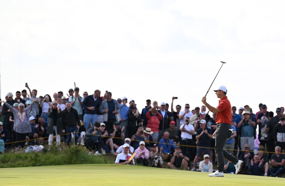 Rory McIlroy celebrates holing a putt on the 12th hole.