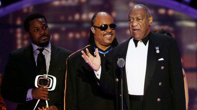 Malcolm-Jamal Warner, left, on stage with singer Stevie Wonder, centre, and Bill Cosby, at awards show in 2011. Pic: AP