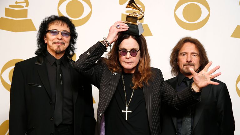 (L-R) Tony Iommi, Ozzy Osbourne and Geezer Butler of Black Sabbath pose with their award for Best Metal Performance at the 2014 Grammys