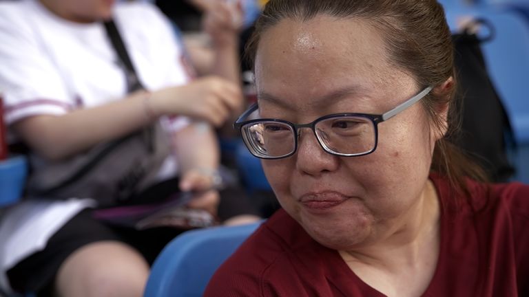 A woman at a baseball game in the Taiwanese city of Taoyuan. She said of Donald Trump “I think he’s quite crazy.”