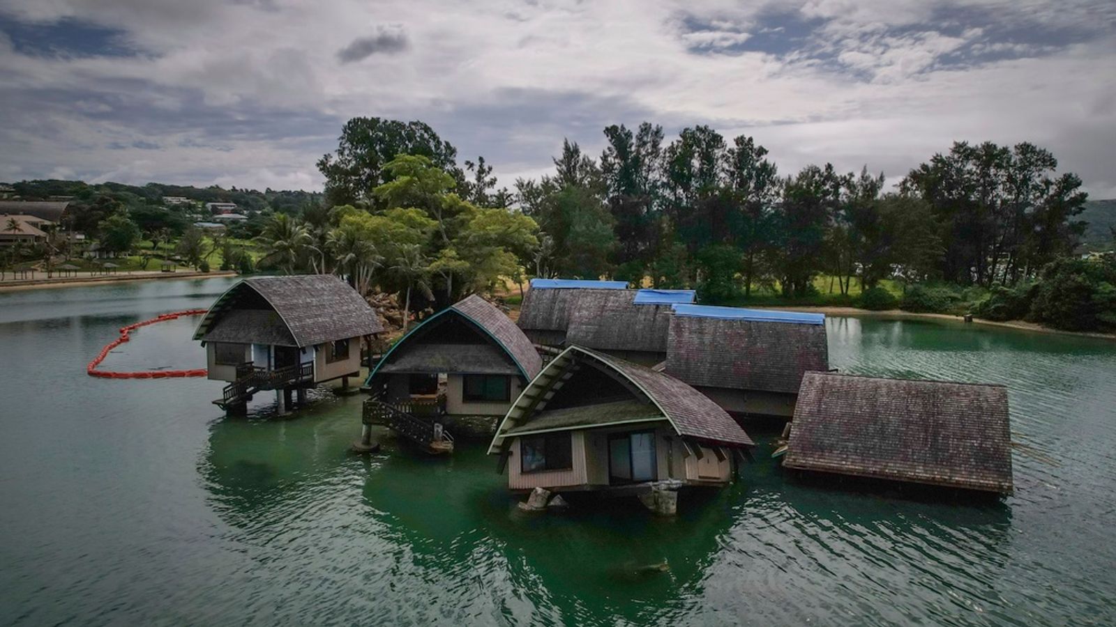 The once iconic Holiday Inn villas in Port Vila, Vanuatu, sit partially sunken Saturday, July 19, 2025, after being hit by multiple cyclones and an earthquake that caused irreparable damage. (AP Photo/Annika Hammerschlag)