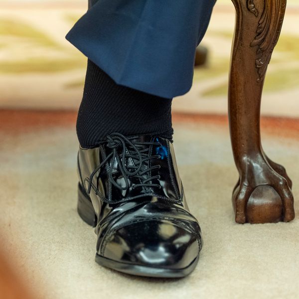 The left foot and swollen ankle of President Donald Trump are pictured as he sits with Bahrain's Crown Prince Salman bin Hamad Al Khalifa in the Oval Office of the White House, Wednesday, July 16, 2025, in Washington. (AP Photo/Alex Brandon)