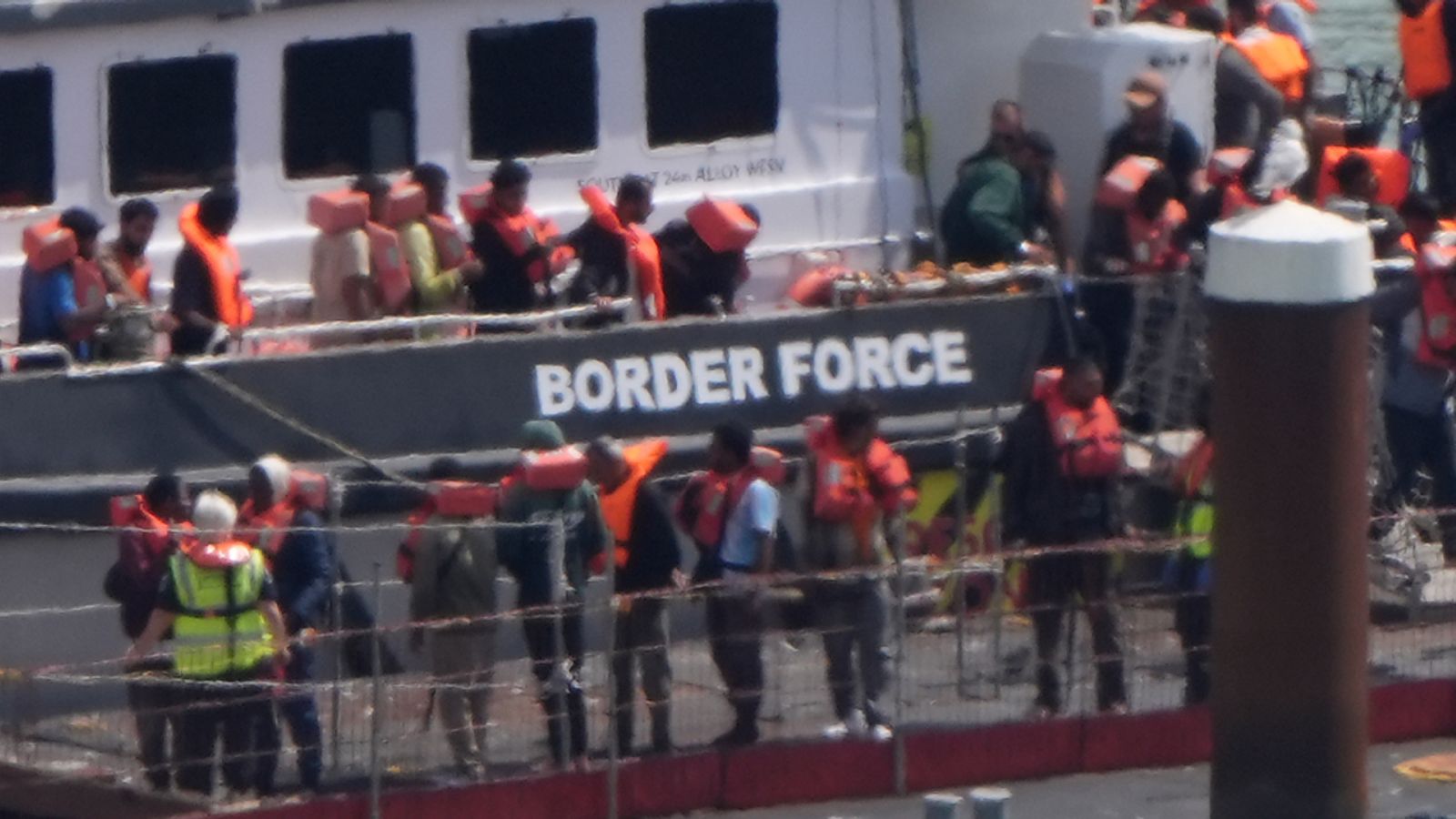 A group of people thought to be migrants are brought in to the Border Force compound in Dover, Kent. Pic: PA