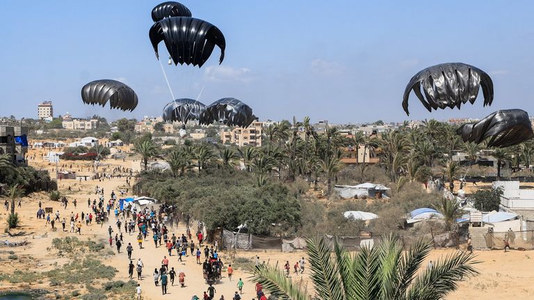 Aid packages descend over Gaza. Pic: Reuters