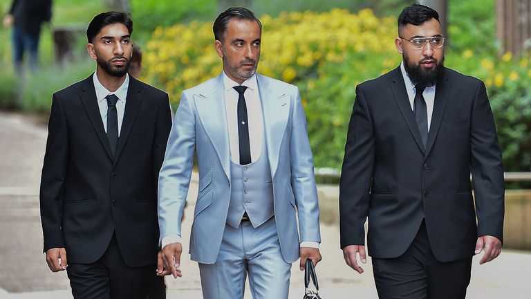 Human Rights lawyer Aamer Anwar (centre) arrives with Mohammed Fahir Amaaz (left) and Muhammed Amaad (right) at Liverpool Crown Court, where