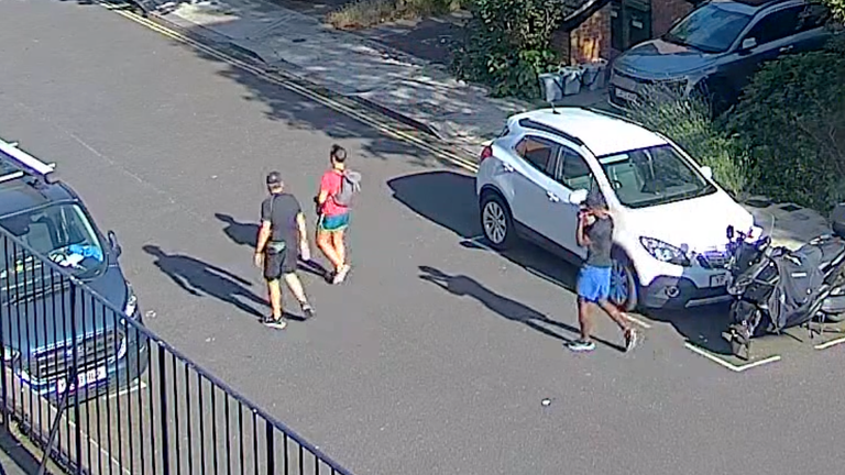 Paul Longworth and Albert Alfonso walk with Mosquera from their house. Pic: Met Police