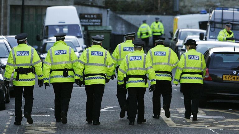 Police pictured outside Linlithgow Sheriff Court in West Lothian where Peter Tobin, 61, was due to appear this morning charged with murderin