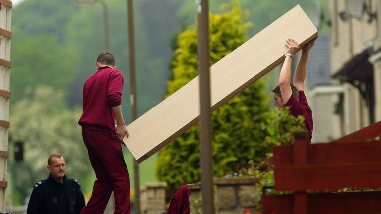 Furniture is removed from the a house police are searching in connection with the disappearance of schoolgirl Vicky Hamilton who went missin