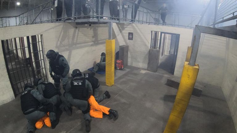 Officers tackled an aggressive 'inmate' after he was distracted by pyrotechnics