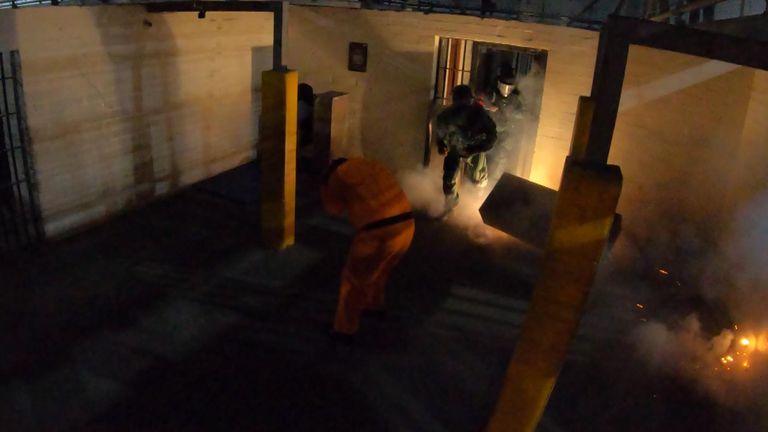 In a demonstration hostage situation, officers used pyrotechnics to distract an aggressive inmate