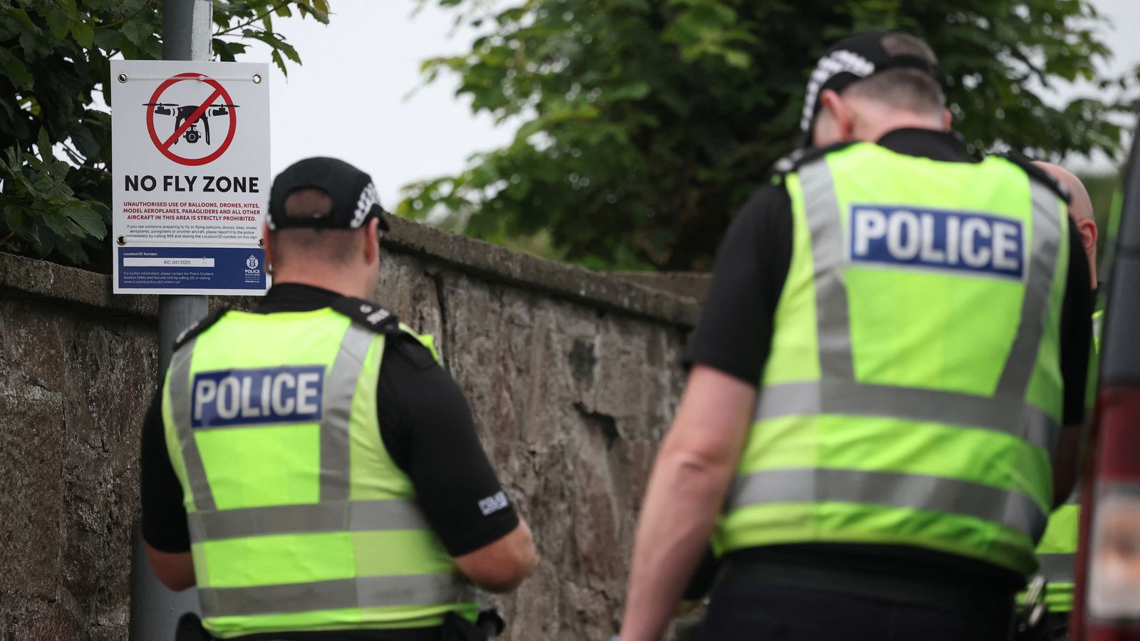 Police officers stand next to a no fly zone sign near to the Trump Turnberry golf course. Pic: Reuters