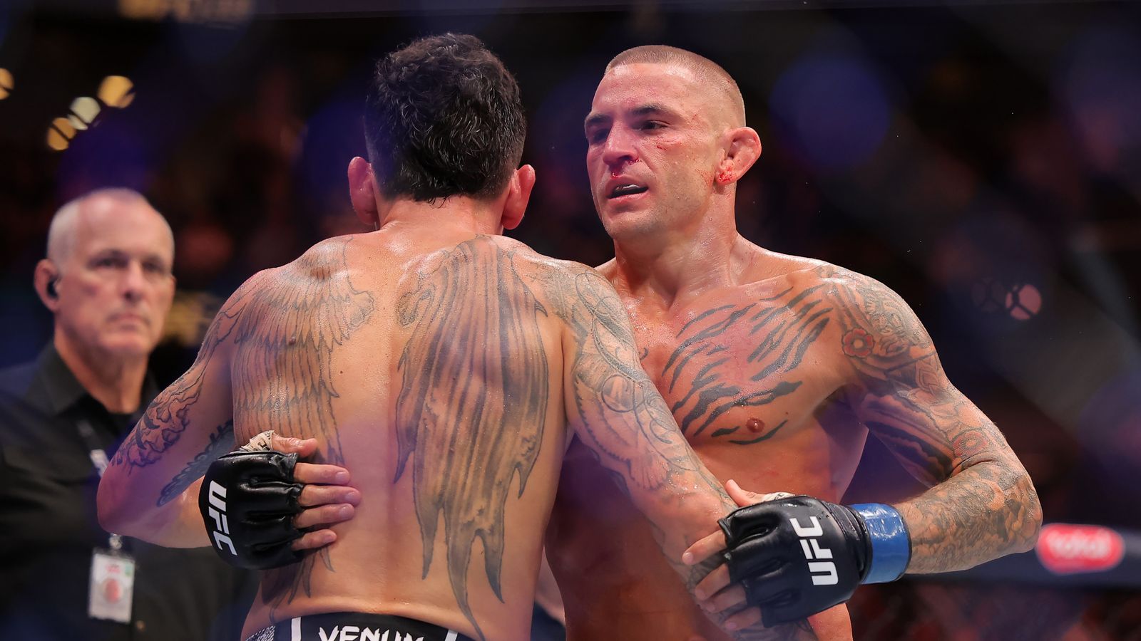 Holloway defeated Dustin Poirier (left) in a unanimous decision to retain the UFC BMF Championship in UFC 318 at the Smoothie King Center.
