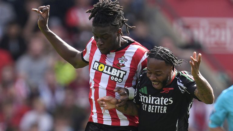 Southampton's Lesley Ugochukwu (left) and Arsenal's Raheem Sterling battle for the ball 