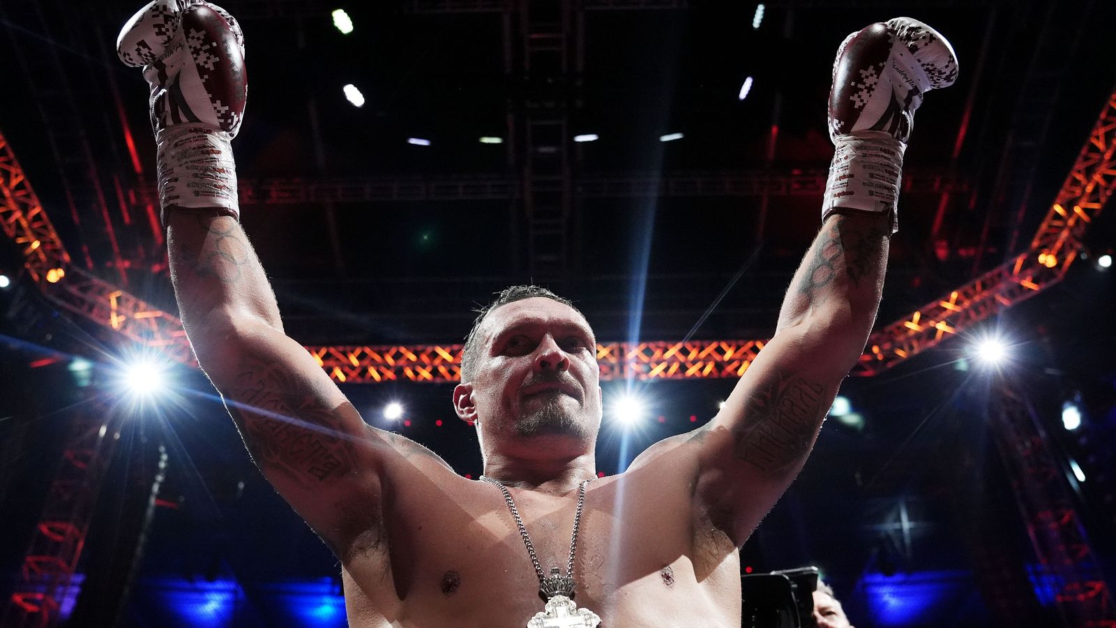 Oleksandr Usyk celebrates after knocking down Daniel Dubois in the fifth round at Wembley