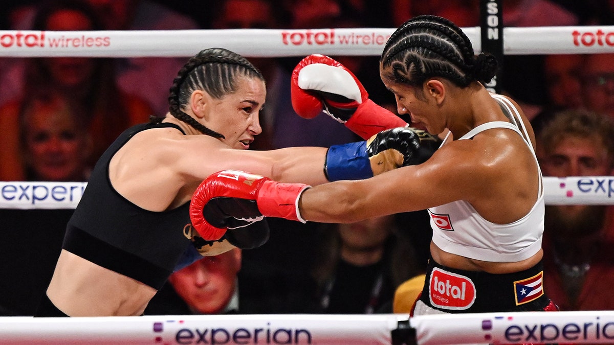 Katie Taylor and Amanda Serrano in ring