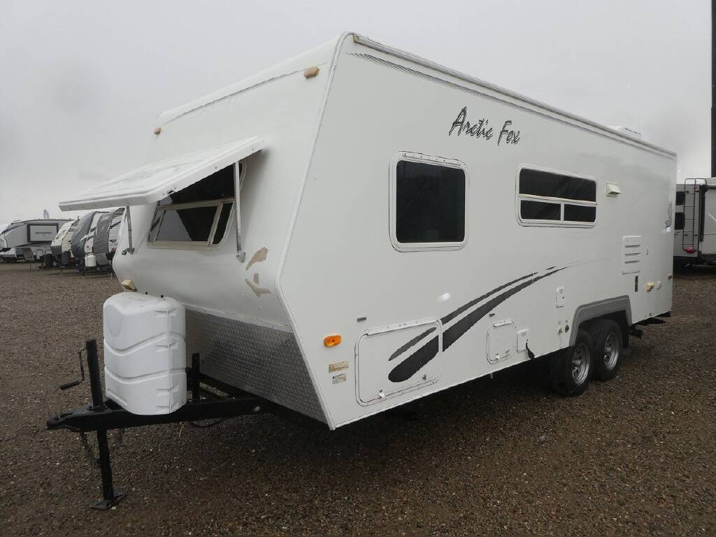 A stock image of a 2006 white Arctic Fox trailer