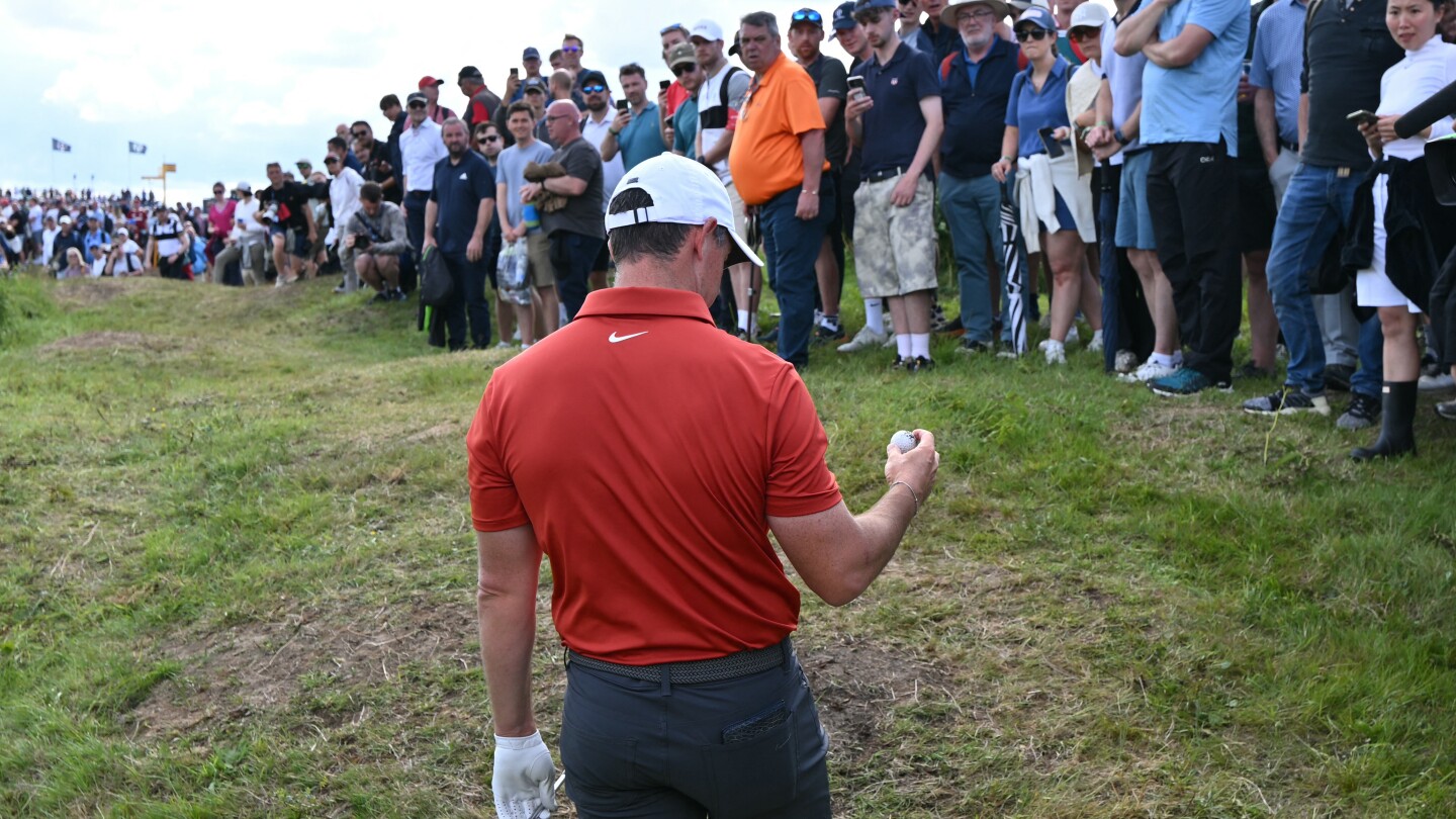 Rory McIlroy hits two balls in one shot during wild third round at The Open