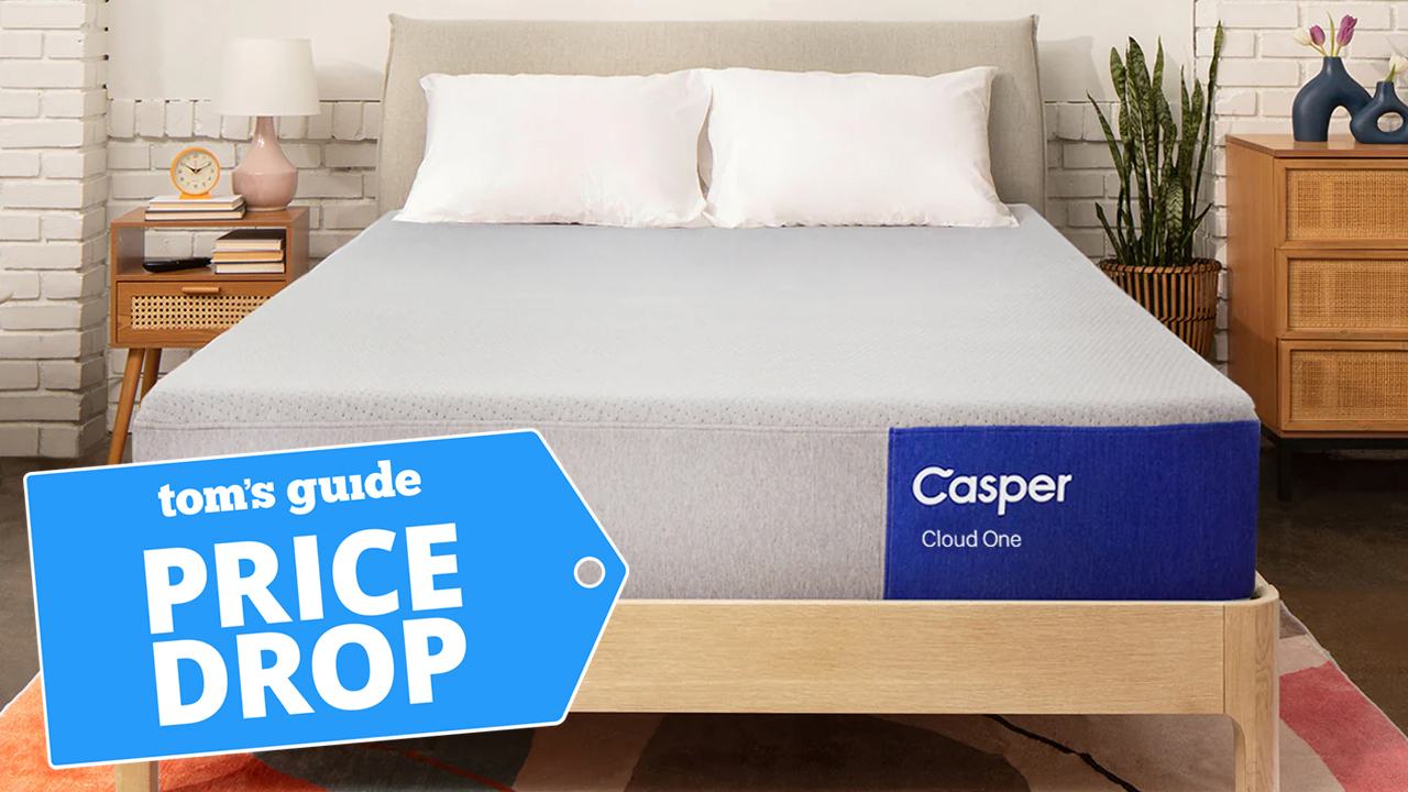 A Casper Cloud One mattress on a wooden bed frame in a bedroom, a Tom's Guide price drop deals graphic in the corner