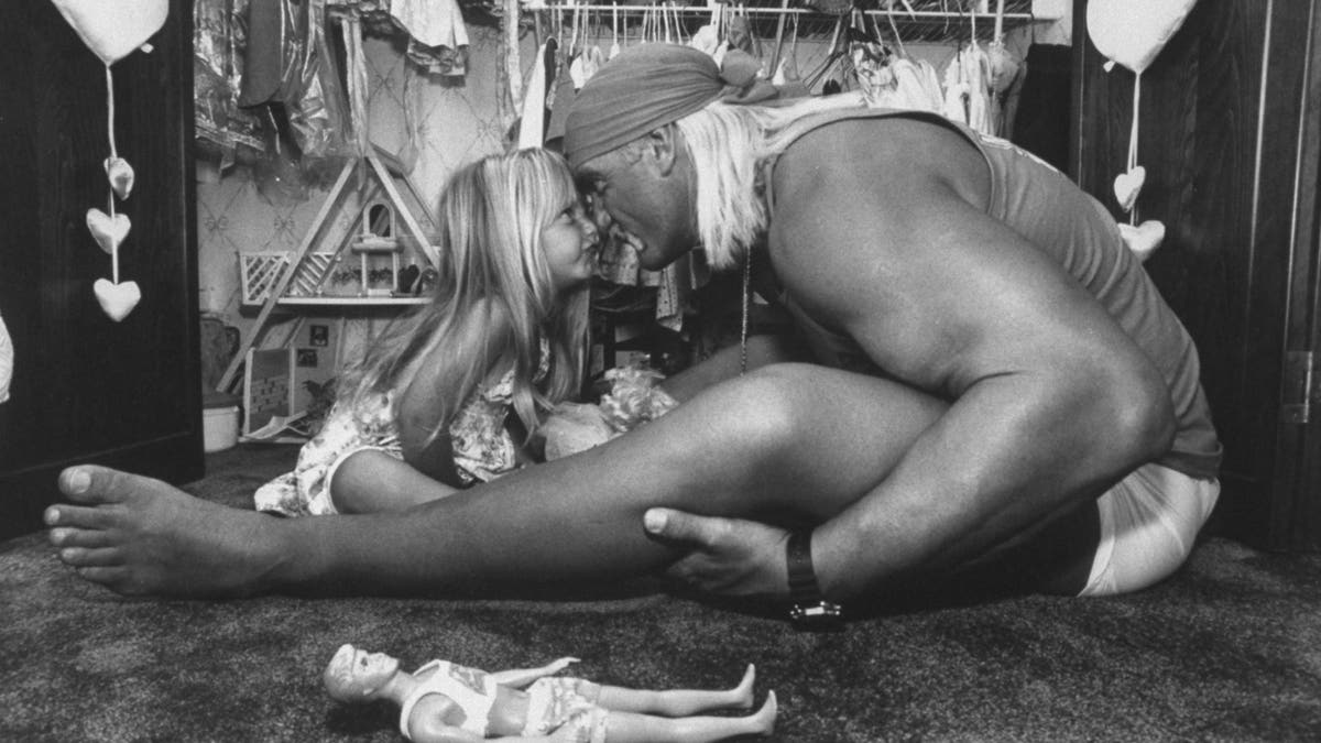 young brooke hogan touching noses with hulk hogan 